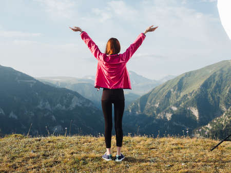 cheerful woman in the mountains nature outdoor activities jumpの写真素材