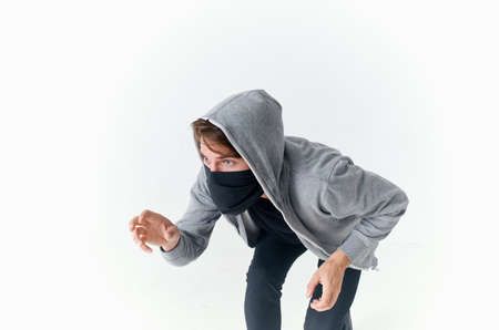 a man in a hood with a balaclava on his face anonymity crime theftの写真素材