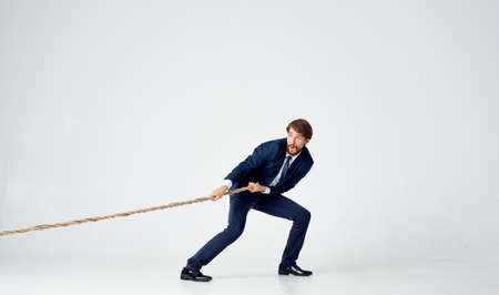 business man work red desk office light backgroundの写真素材