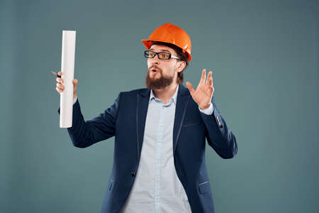 surprised man orange helmet on the head Studio hand gesture