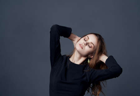 woman holding her head black dress decoration luxury glamor