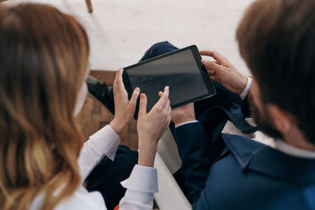 man and woman in business suits work with a tablet managers professionalsの写真素材