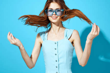 woman in a dress and glasses isolated background attractive look