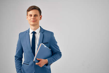 business man in suit blue folder successful manager work officeの写真素材