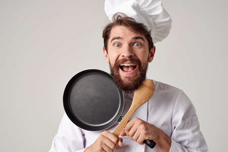 Cheerful man chef kitchen restaurant cooking workの写真素材