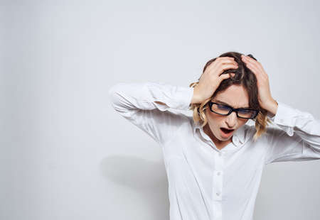 woman in white shirt emotion office studio light background businesswoman