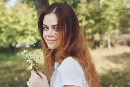 pretty woman holding flowers Lifestyle summerの写真素材