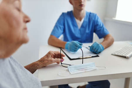 elderly woman at the doctors appointment hospital treatment health care