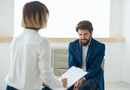 woman consults man psychology depression communication workの写真素材