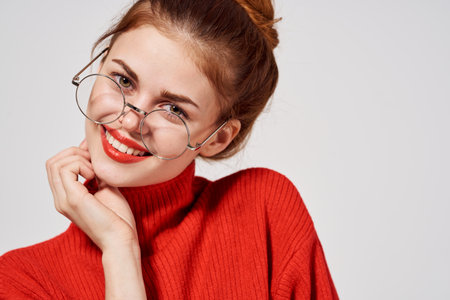 portrait of a woman Red lips attractive look light backgroundの写真素材