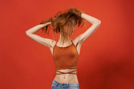 pretty woman in red t-shirt jeans fashion decoration