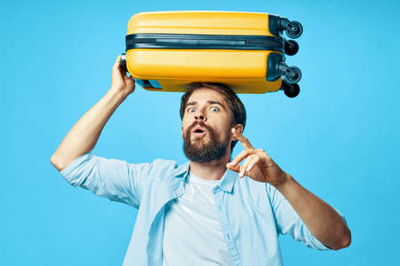 man in shirt with luggage on his head tourism travel airportの写真素材
