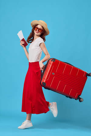 woman with a red suitcaseの写真素材
