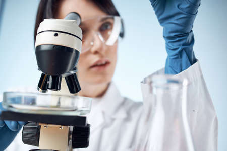 woman scientist microscope diagnostics research technologyの写真素材