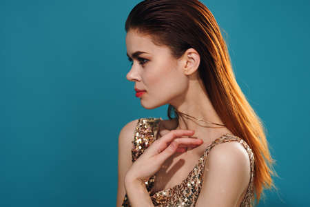 pretty woman in dress side view posingの写真素材