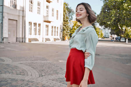 cute blonde red skirt outdoors outdoors square walkの写真素材