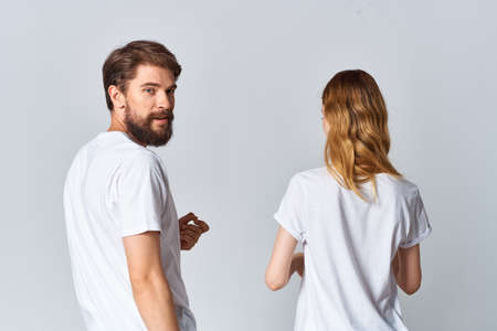 man and woman in white t-shirts design studio back view mocapの写真素材