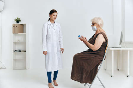 Emotional Nurse And Patient Big Syringe Hospitalの写真素材