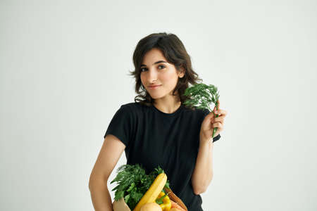 cheerful brunette shopping for groceries in the store healthy foodの写真素材