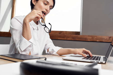 Business woman secretary work desk office laptop communicationの写真素材