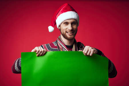 man wearing new year clothes green poster decoration isolated background mockupの写真素材