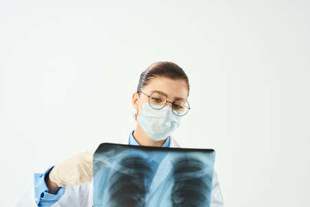 doctor wearing medical mask x-ray examination diagnosis hospital