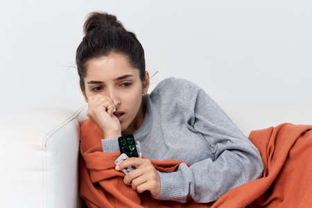 woman at home putting on health problems flu virus