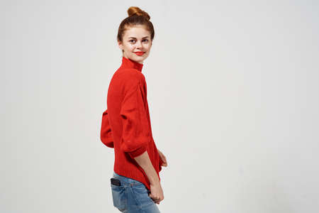 pretty woman in a red sweater attractive look