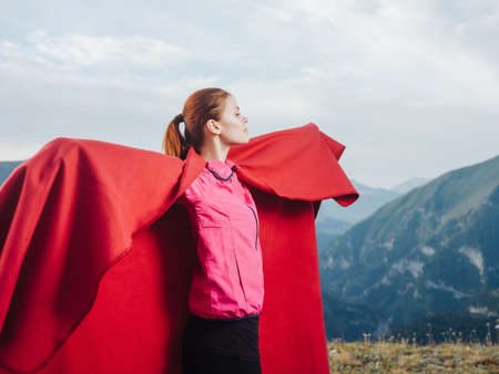 woman in a red plaid in the mountains outdoors fresh air coolの写真素材