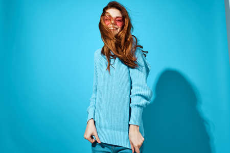 beautiful woman in a blue sweater Studio funの写真素材
