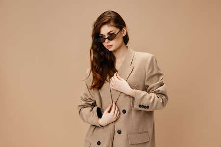 woman with glasses Glamor beige coat portrait Copy Spaceの写真素材