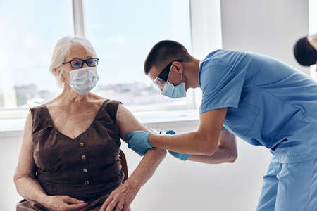 patient and doctor vaccine passport patient treatmentの写真素材