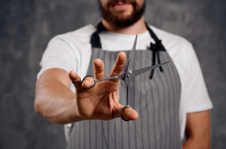 hairdresser scissors in hands professional work barbershopの写真素材