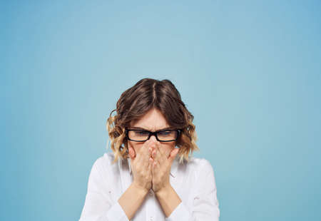 emotional business woman in white shirt gesturing with her hands studioの写真素材