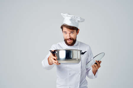 male chef with white hat on his head restaurant kitchen serviceの写真素材