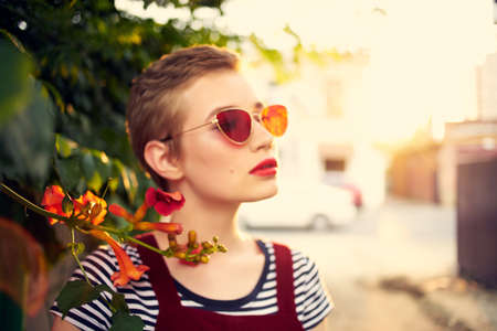 woman wearing sunglasses flowers firing fresh airの写真素材