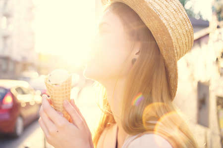 beautiful woman outdoor walk eat ice cream walk travel funの写真素材