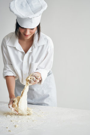 woman baker cooking baked goods homework professionalの写真素材