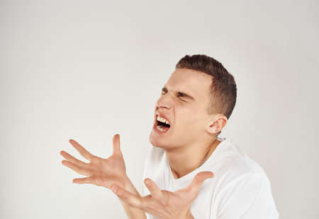 crazy man in white t-shirt emotions studioの写真素材