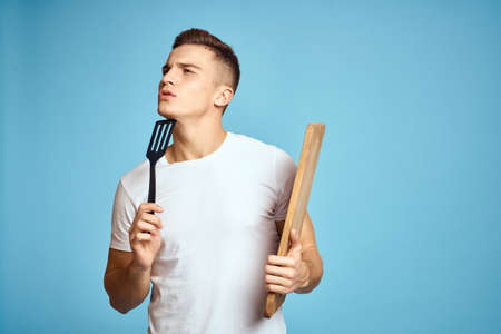 man in white t-shirt at home isolated background lifestyleの写真素材