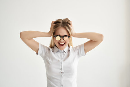 Businesswoman Bitcoin glasses light backgroundの写真素材