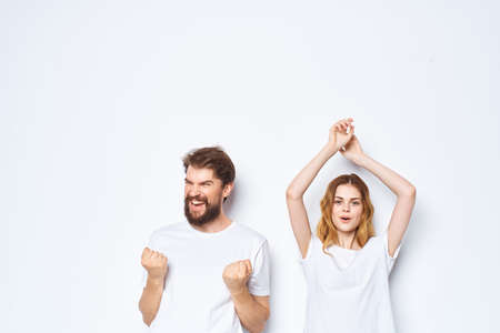 young couple in white t-shirts and jeans Friendship on emotions mockupの写真素材