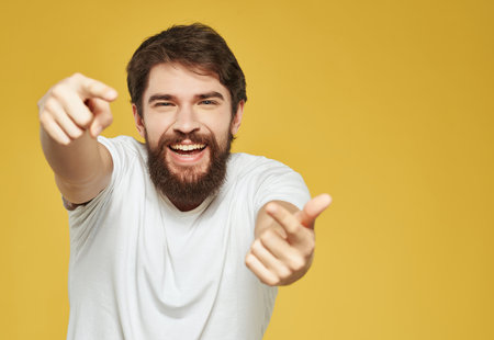 emotional man in a white t-shirt irritated facial expression close-upの写真素材