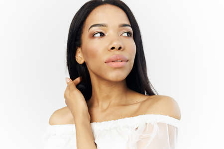 woman african appearance attractive look makeup posing light backgroundの写真素材