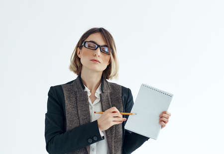 Business woman in glasses with notepad documents office managerの写真素材