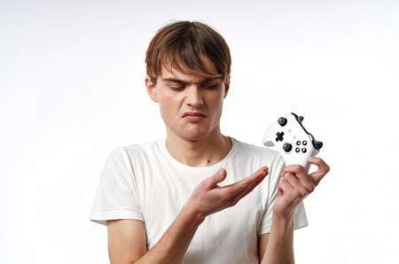 guy in white t-shirt joystick games technology entertainment