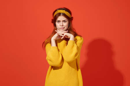 pretty woman with headband hippie accessories decoration red backgroundの写真素材