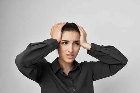 brunette migraine stress negative light backgroundの写真素材