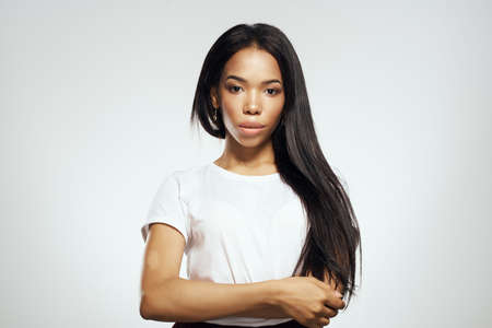 pretty woman in white t-shirt long hair fashionの写真素材