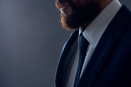 The man in a suit executive office dark backgroundの写真素材
